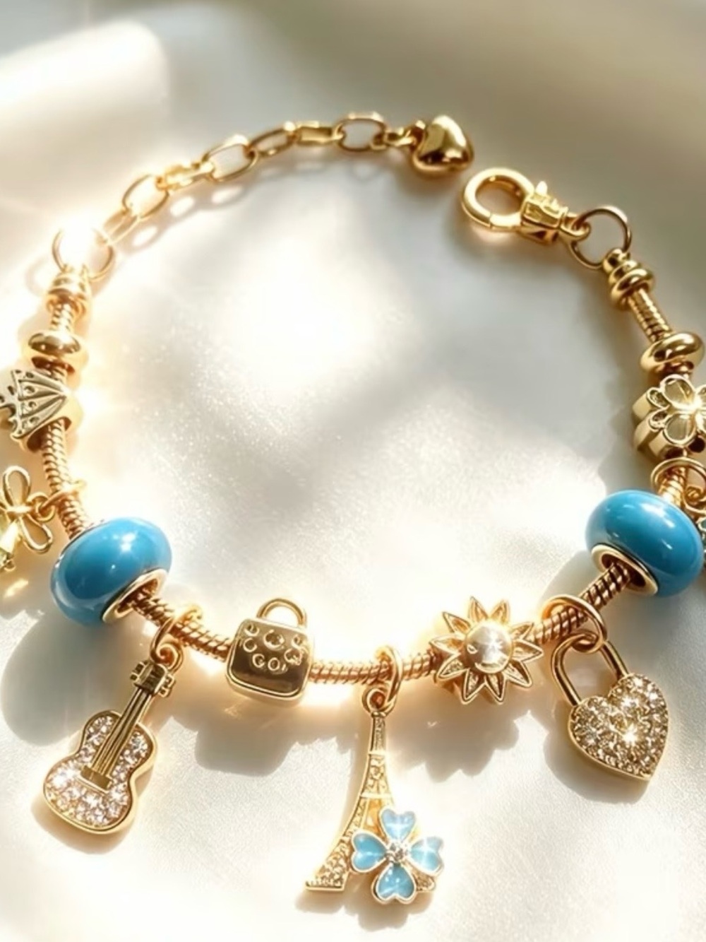 Gold Charm Bracelet with Blue Enamel Beads and Heart & Eiffel Tower Charms